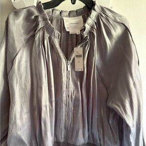ANTHROPOLOGIE Shimmering Silver zippered jacket.
